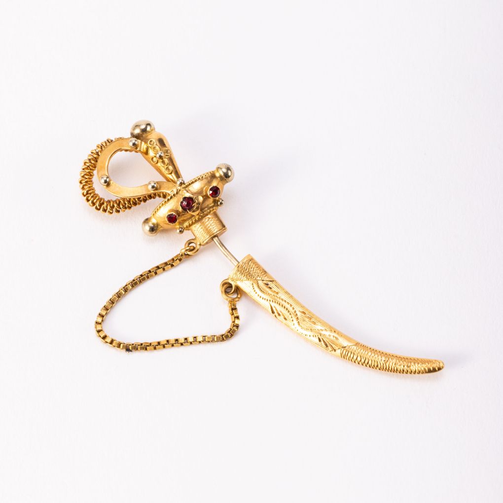 Yellow Gold Saber Shaped Tie Pin with Garnets